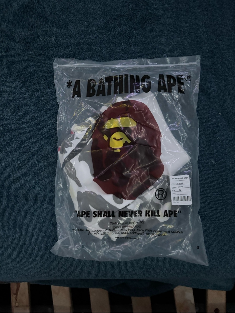 A Bathing Ape Men’s White Graphic Tee with Brown Ape Head